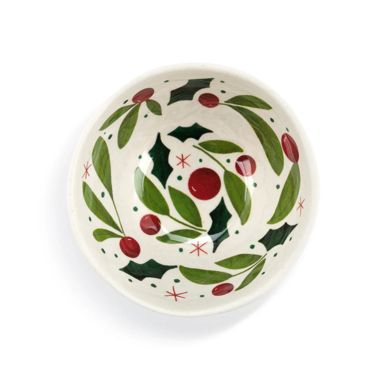White ceramic bowl with holly leaves and red berries Christmas design