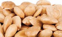 Close-up of unshelled cashew nuts showcasing their natural curved shapes and smooth texture