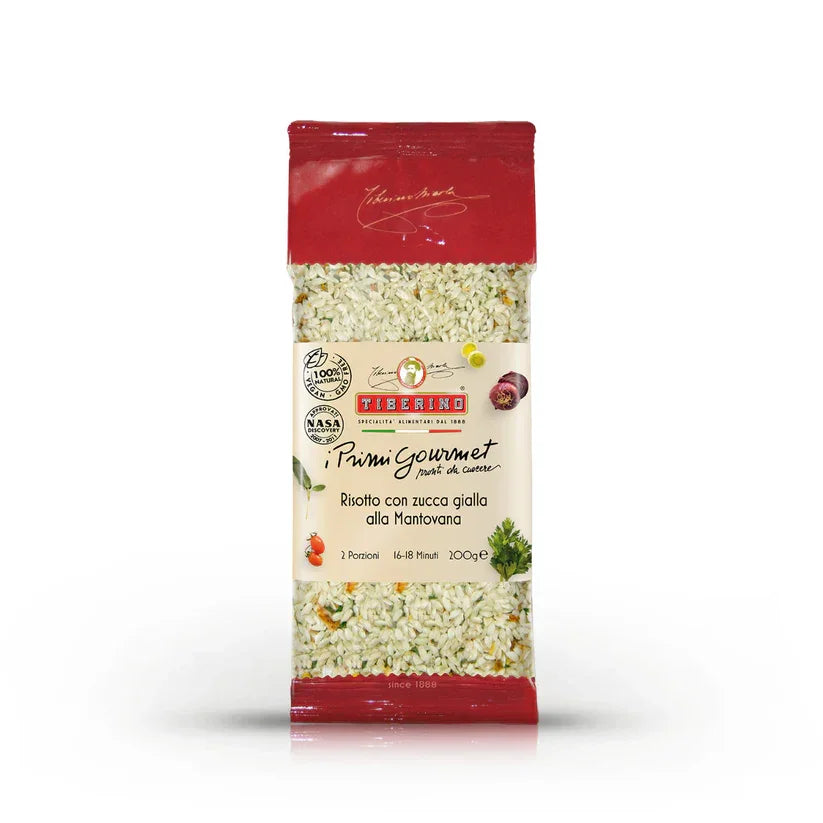 Package of Tiberino Risotto con zucca gialla alla Mantovana with visible grains of Carnaroli rice and pumpkin pieces