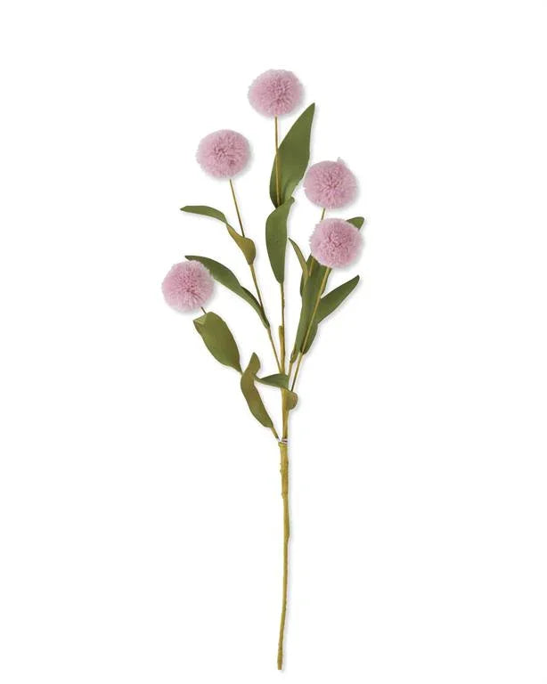 Artificial flower stem with five pink pom-pom blooms and green leaves on white background