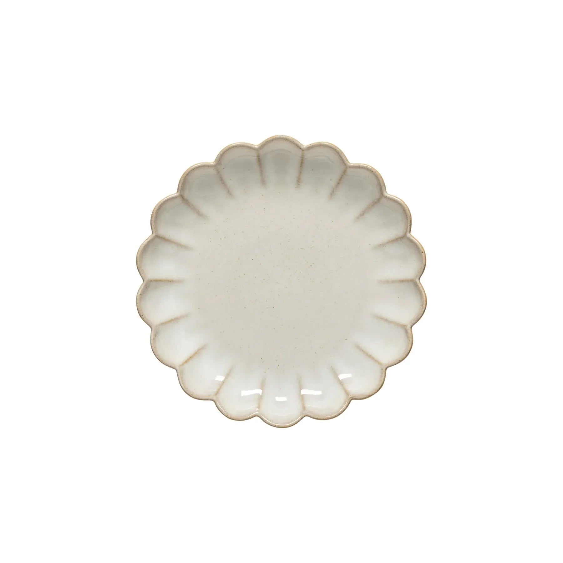 White ceramic plate with scalloped edges and subtle beige speckles