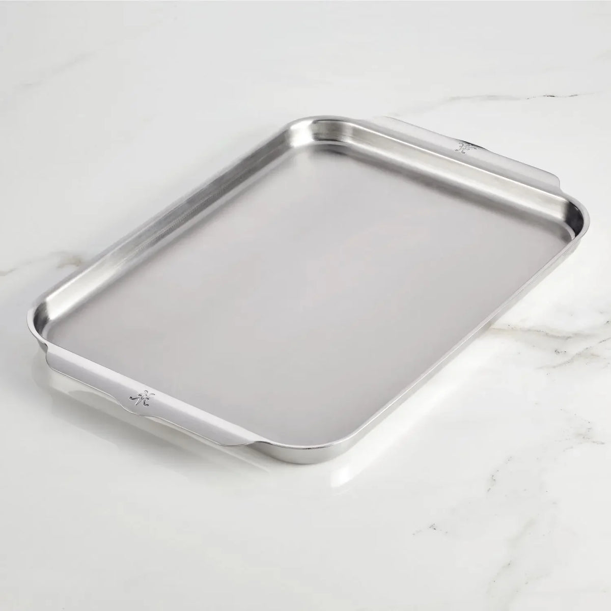 HESTAN Provisions OvenBond stainless-steel half sheet pan on a white marble surface
