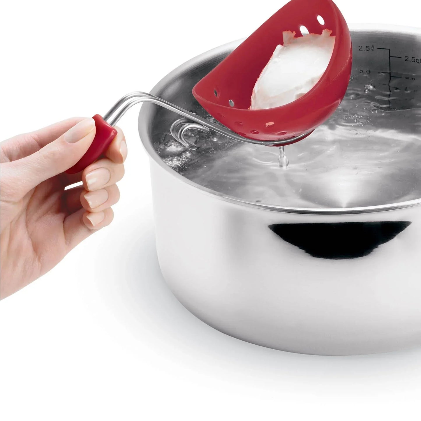Hand holding red silicone egg poacher over boiling water in stainless steel pot