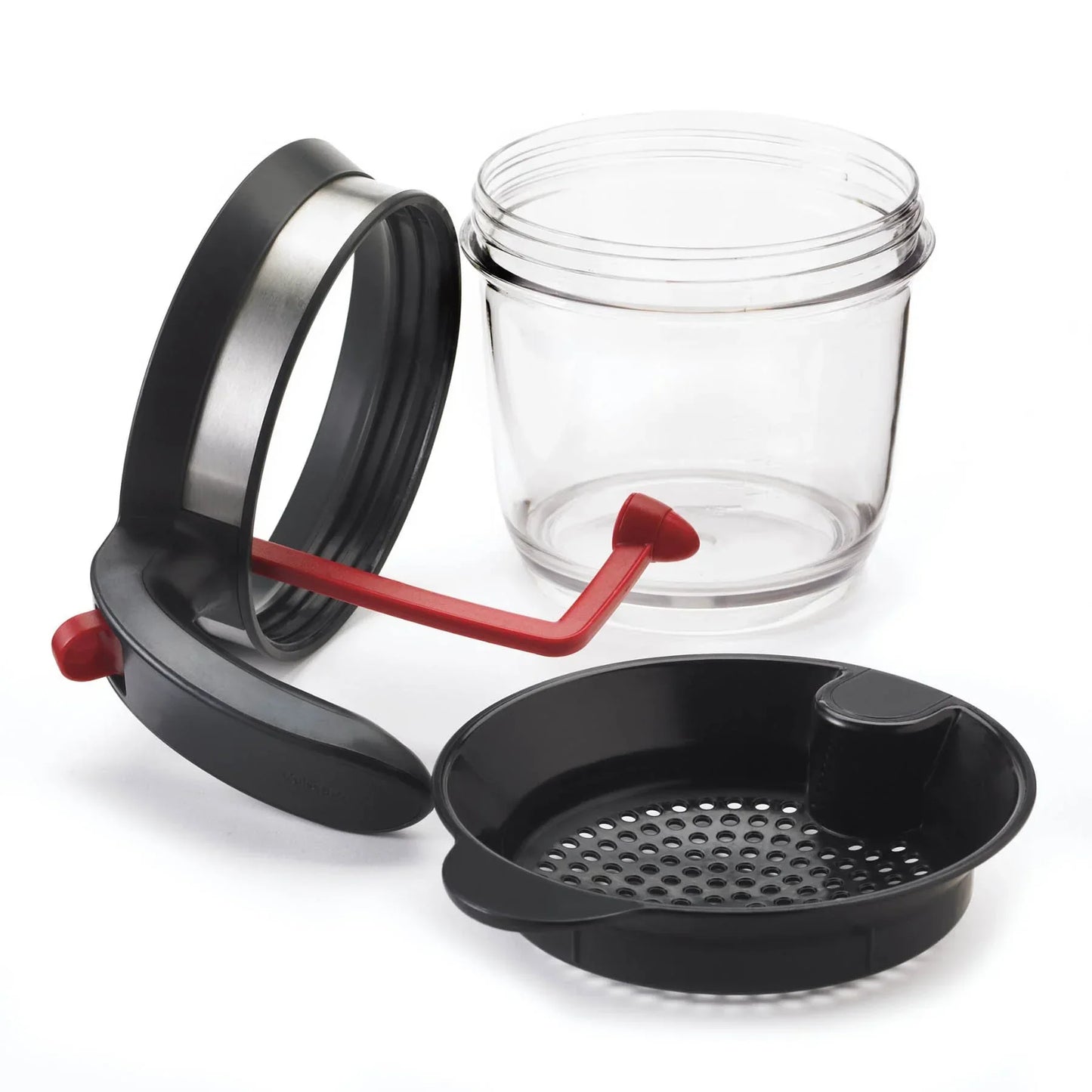 Transparent plastic container with black lid and attached red crank, plus a black perforated strainer