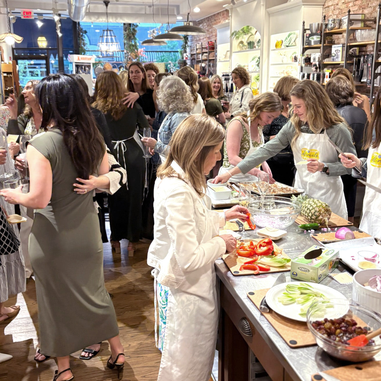 Guests participating in a Corporate Cocktail cooking class at Marcel's Culinary Experience in Glen Ellyn, Illinois