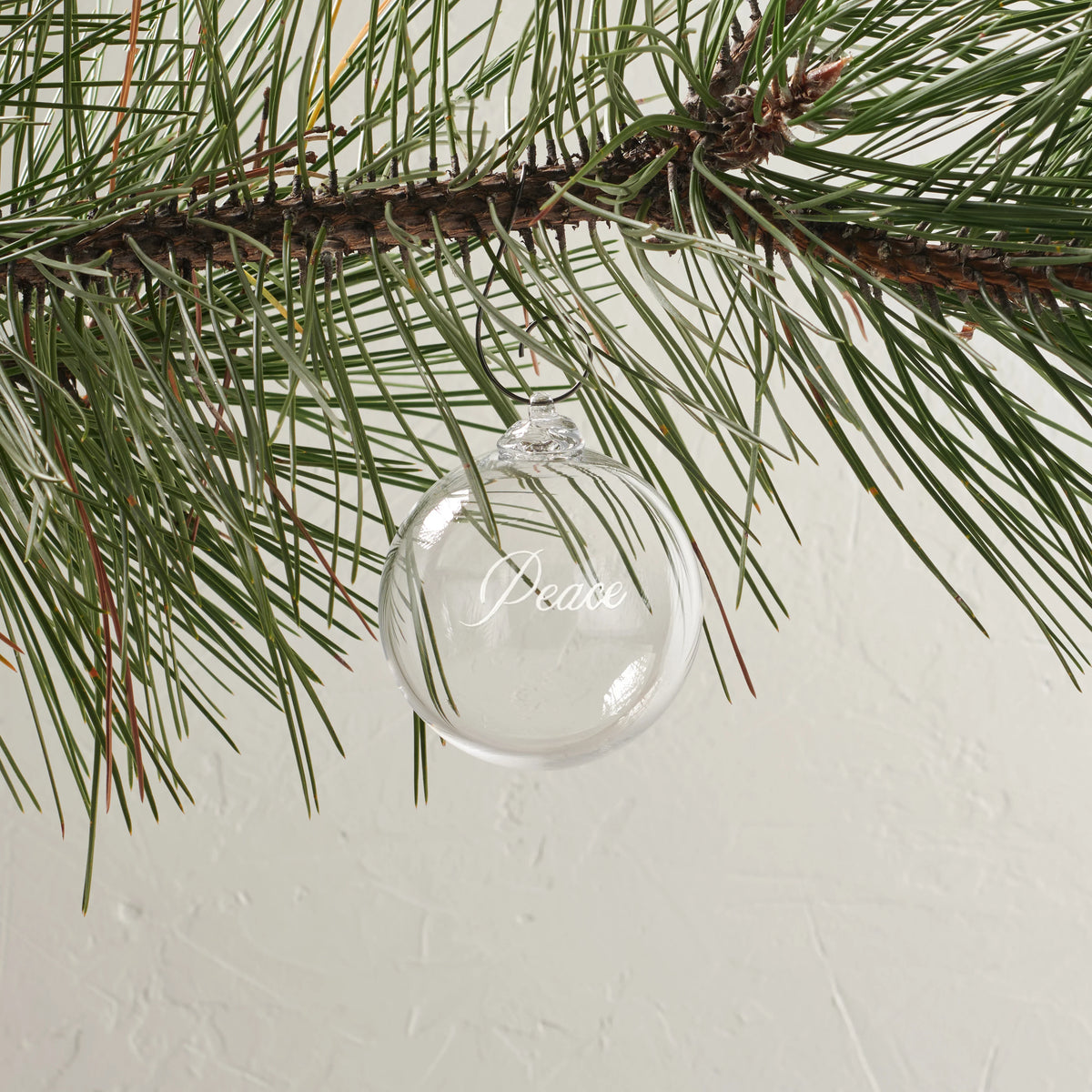 Simon Pearce Engraved Peace Ornament