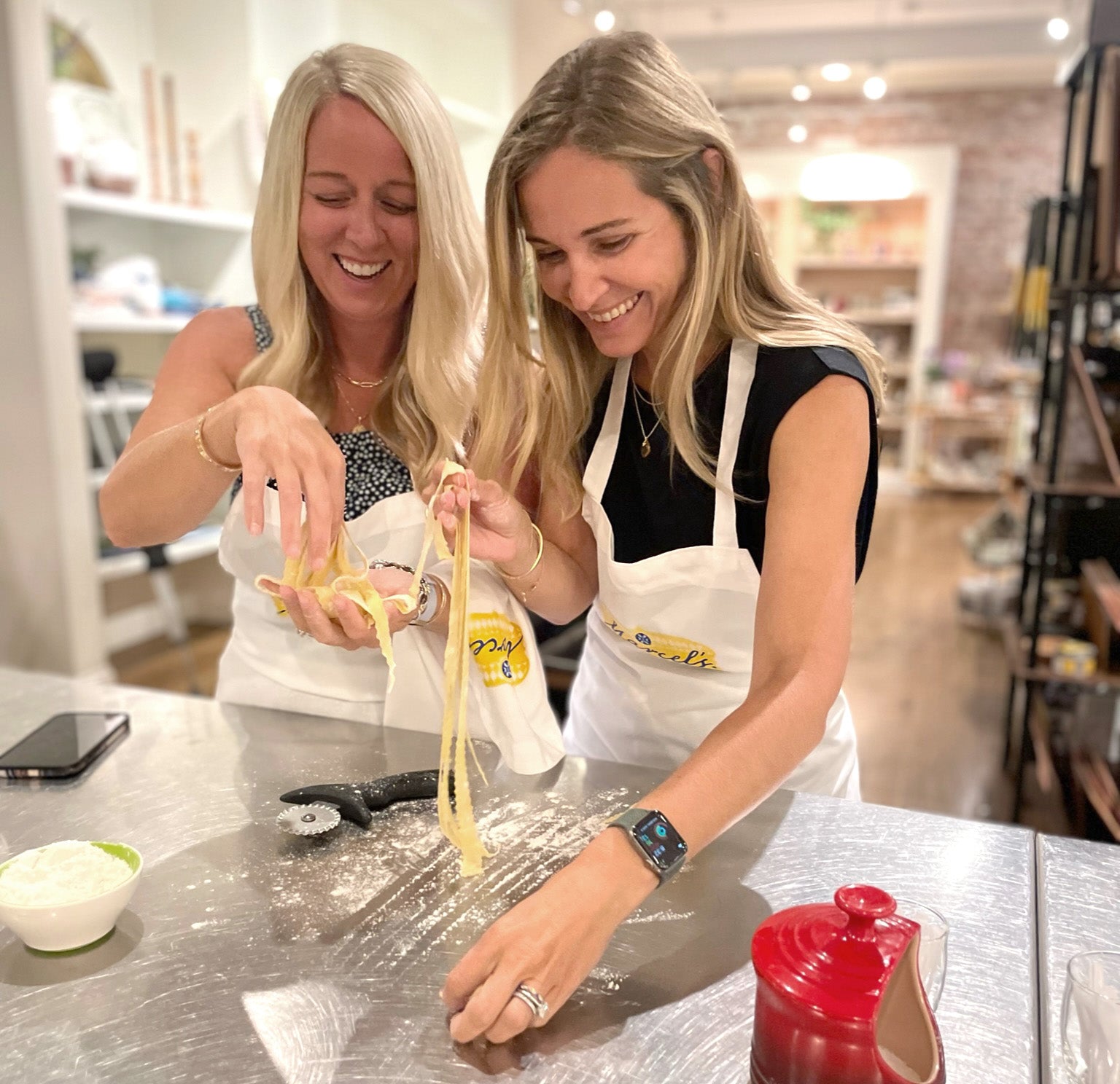 Chef-led hands-on corporate cooking class for groups at Marcel's Culinary Experience — guests preparing a multi-course meal together