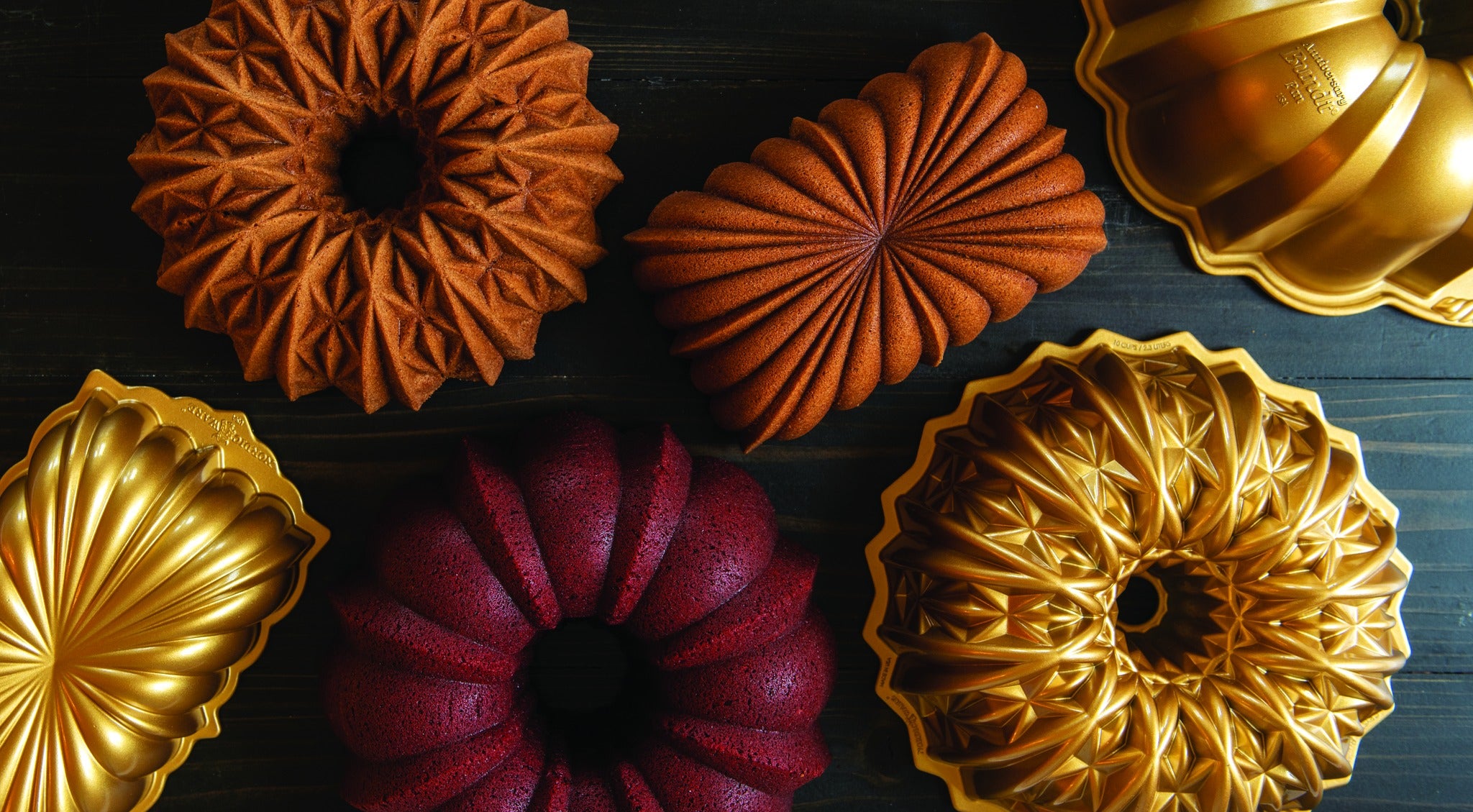 Nordicware Decorative cake tins with intricate designs on a dark surface | Marcel's