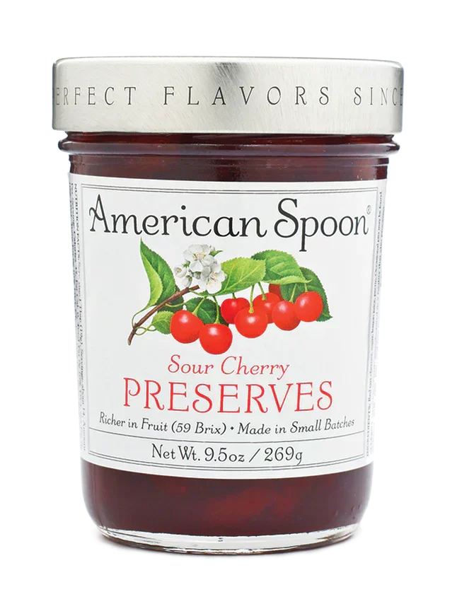 Jar of American Spoon Sour Cherry Preserves with cherry and leaf illustration on label