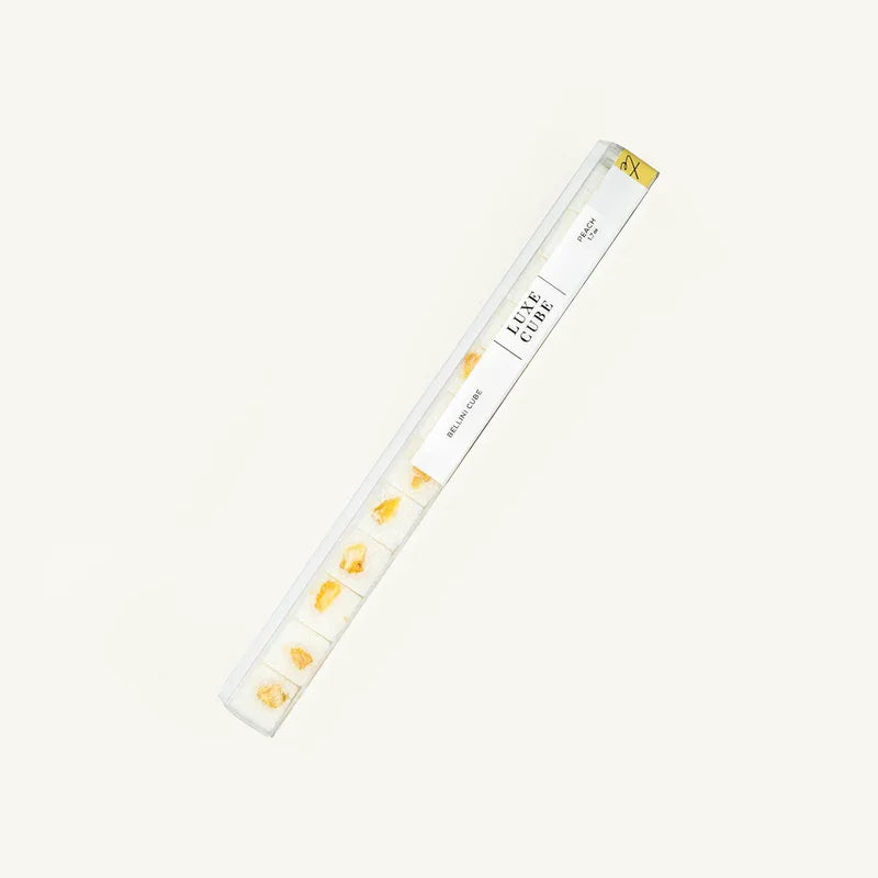 Luxury cube set of peach bellini flavored edible cubes in clear packaging on white background