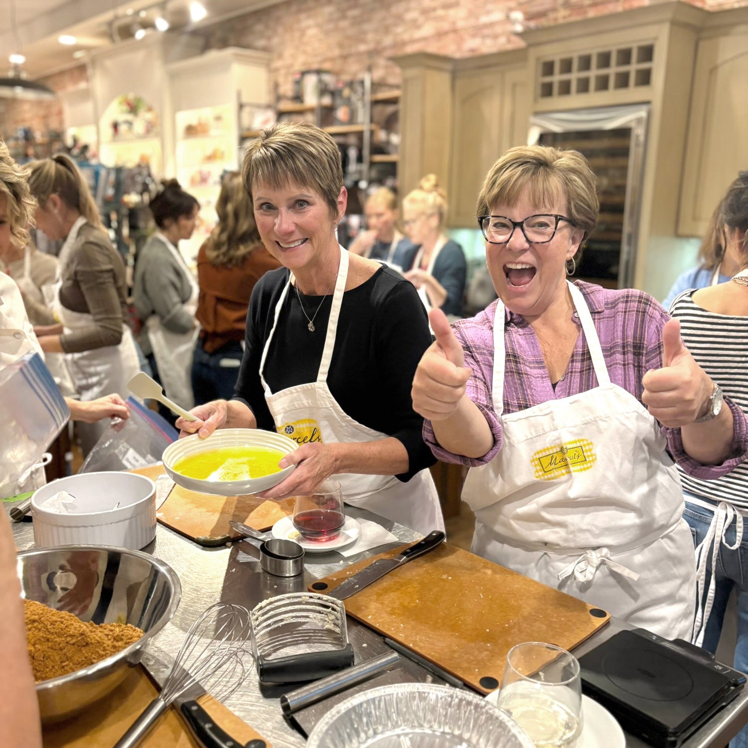Guests having fun at a private cooking event at Marcel's Culinary Experience