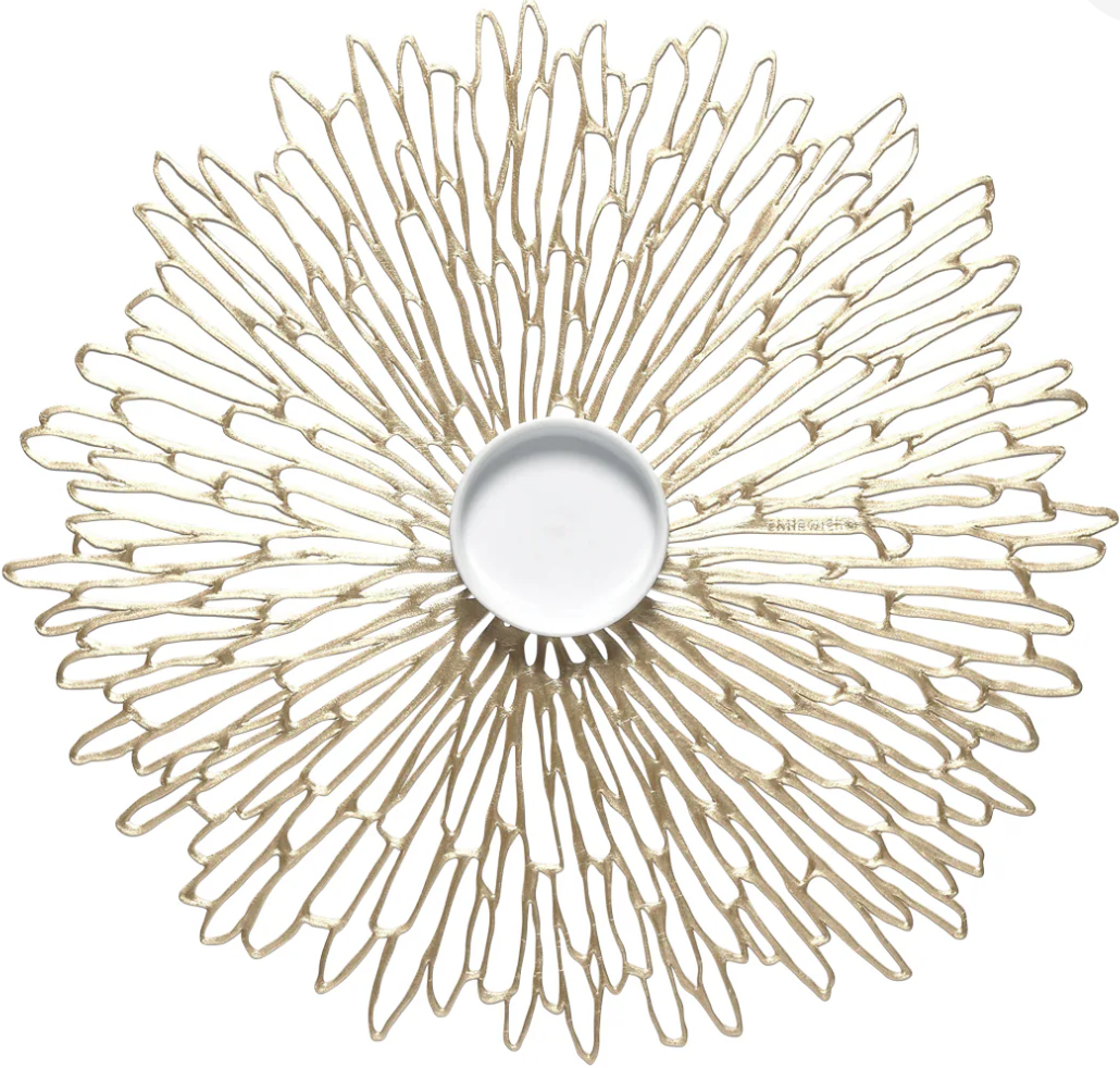 decorative placemat gold finish with small white dish on top