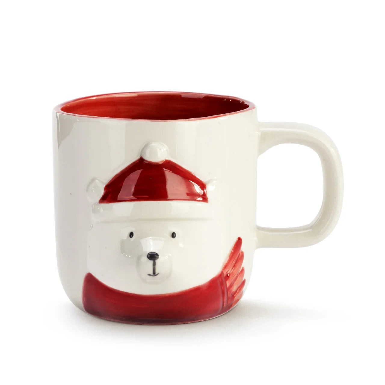 White ceramic mug with red interior featuring a 3D polar bear wearing a red hat and scarf