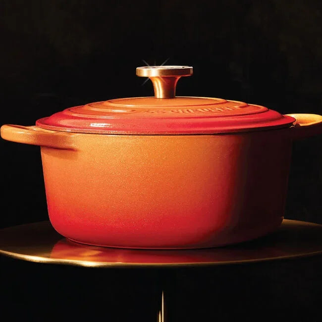Le Creuset Flamme Doree Signature Round Dutch Oven with Crucible Knob - 4.5 Qt black background