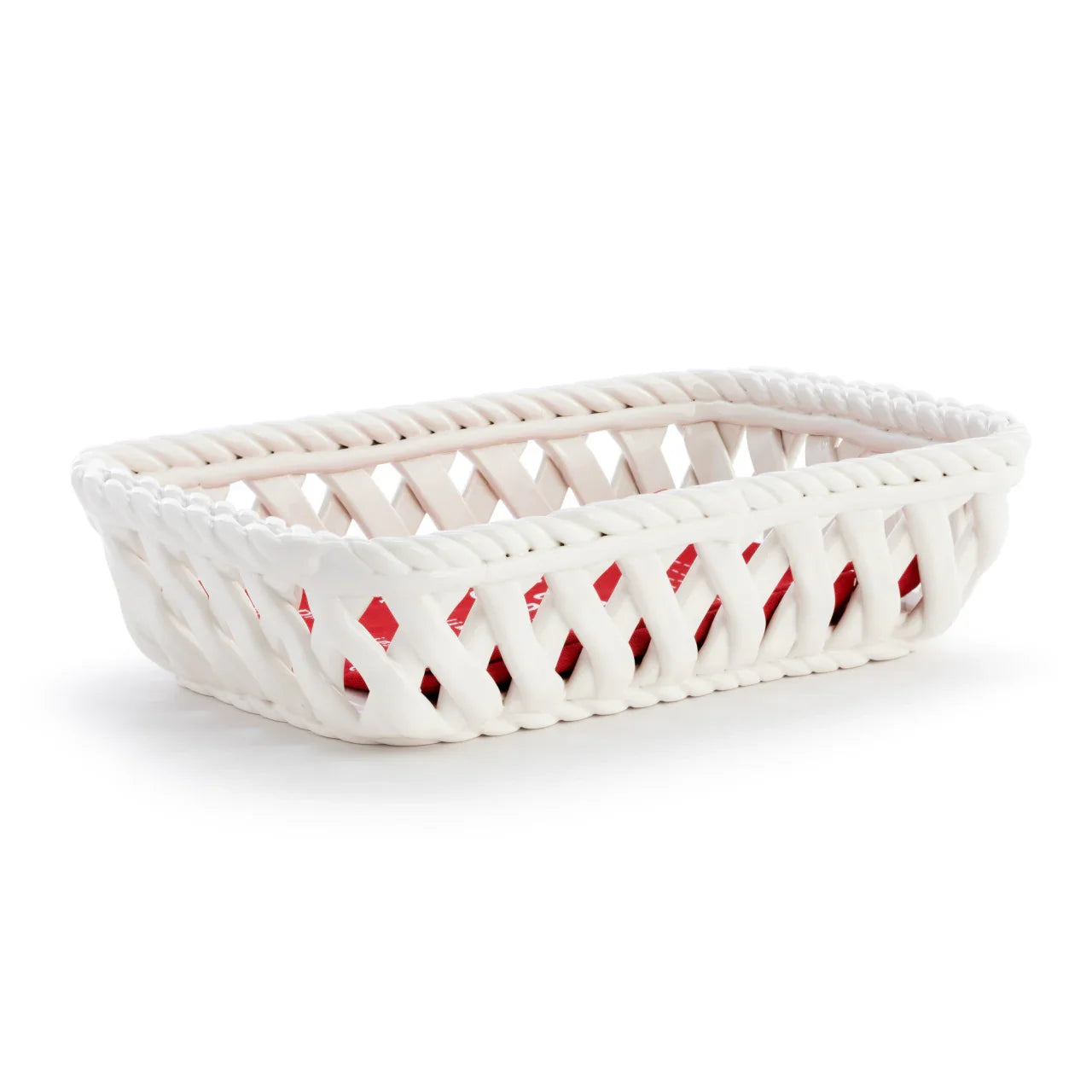 White rectangular ceramic basket with woven textured sides on white background