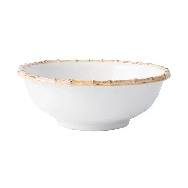 white ceramic serving bowl with bamboo style painted rim
