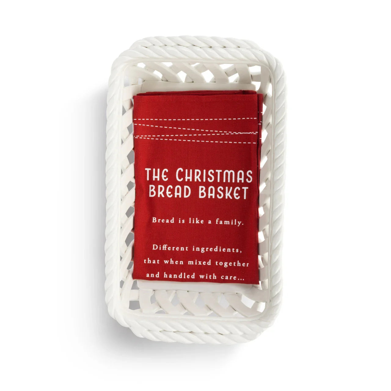 White woven bread basket with folded red cloth labeled The Christmas Bread Basket and holiday bread quote