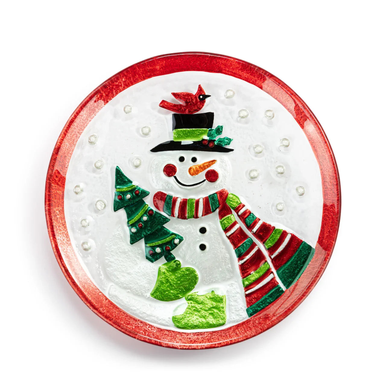Decorative round glass plate with a smiling snowman holding a Christmas tree, red cardinal, and striped scarf