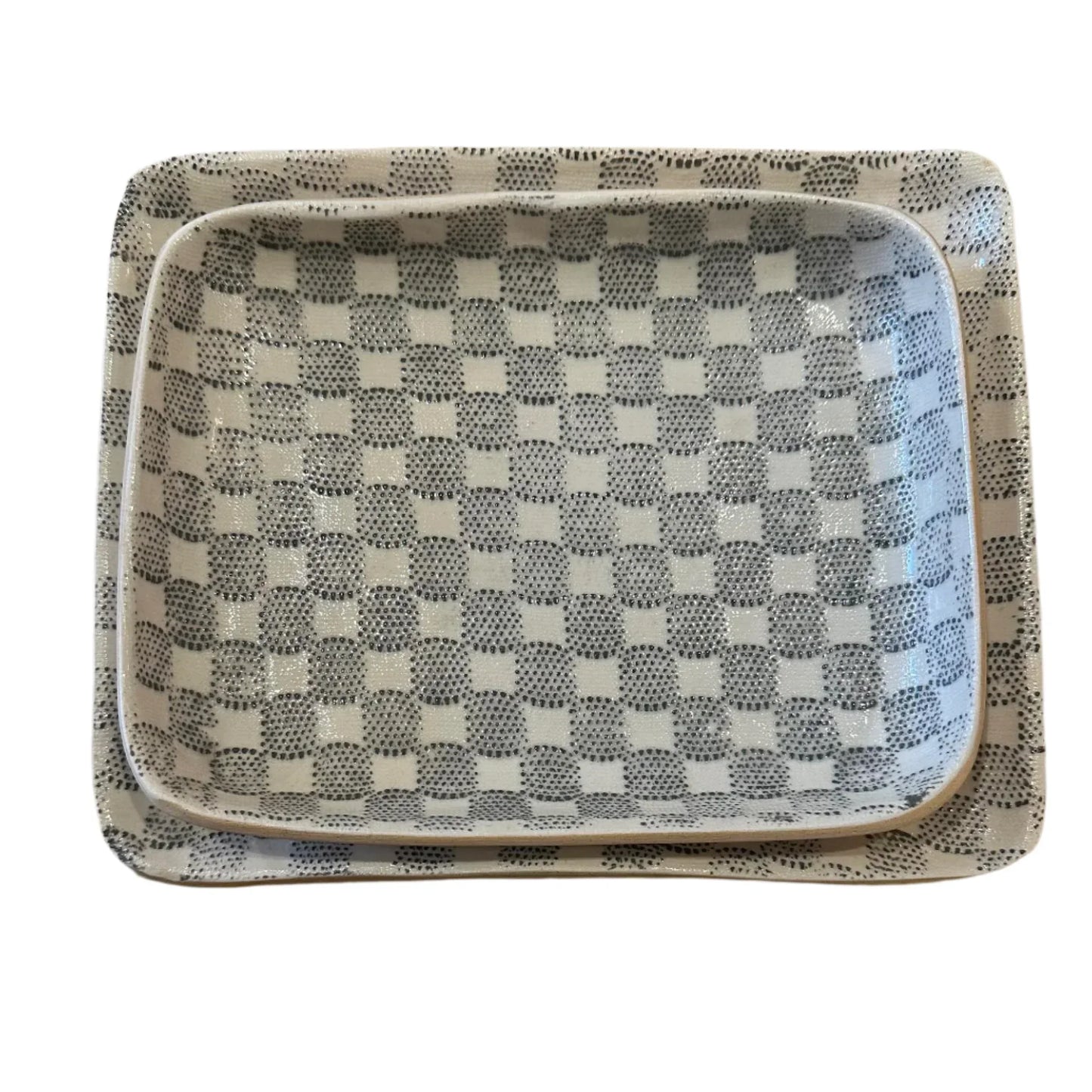 Two ceramic trays with checkered pattern