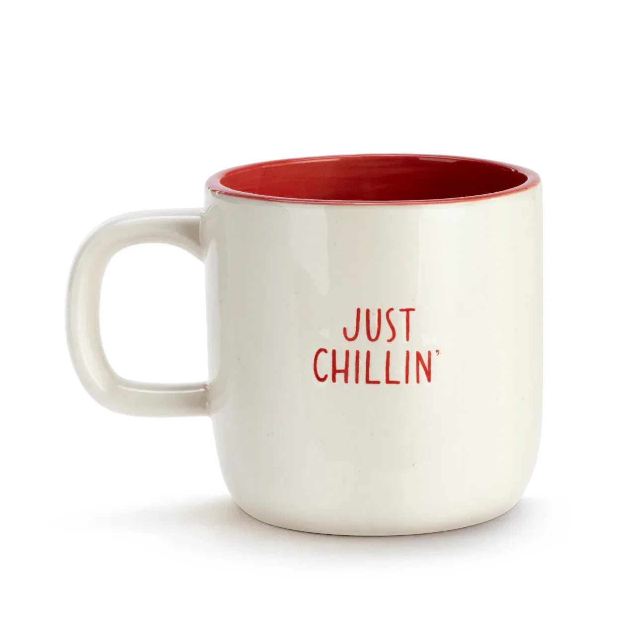 White ceramic coffee mug with red interior and text Just Chillin' on the side